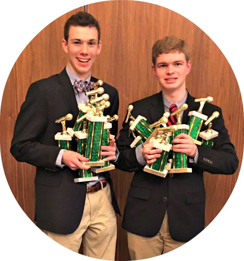 Cooper Boardman (left) and Jack Caldwell, with their 14 trophies. 