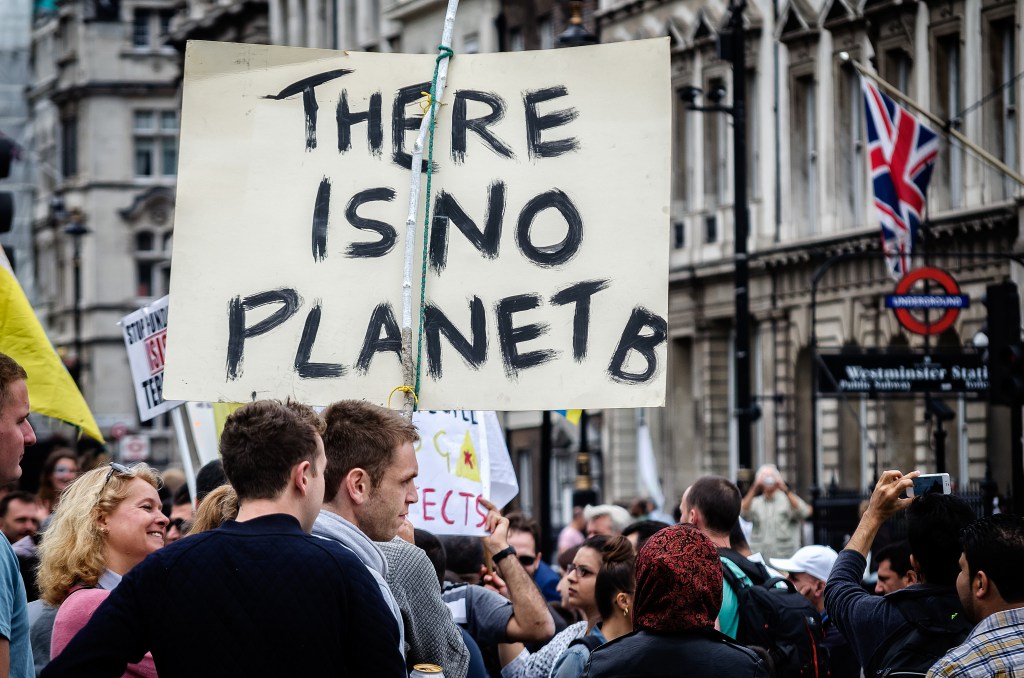 Placard reads "There is no planet B"