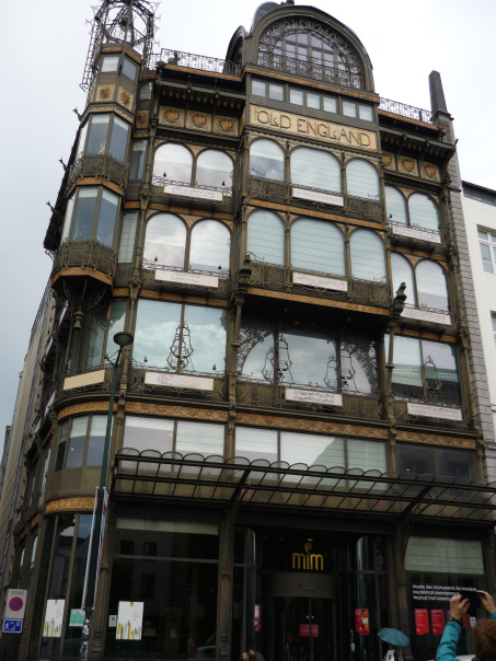 Art Deco building with musical motifs under every window showing the history of written music