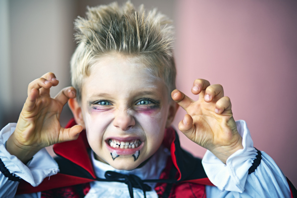 Portrait of a little boy dressed up as halloween vampire