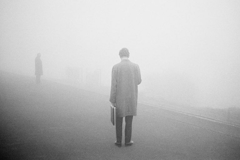 GB. England. Epsom station. From 'Bad Weather'. April 1975.