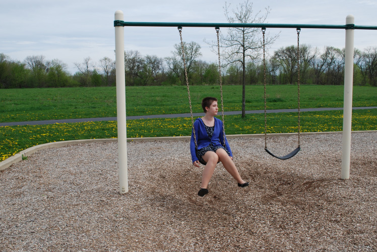 07-24-17 lonely girl on swingset