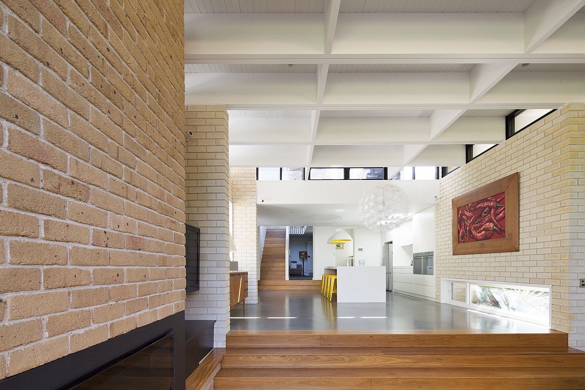 Exposed brick work adds to the beauty of the revamped interior d+k House: Mid Century Modernism Fused with Coastal Style and a Green Roof