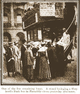 Crowds of mostly women climbing the stairs to fit onto an omnibus